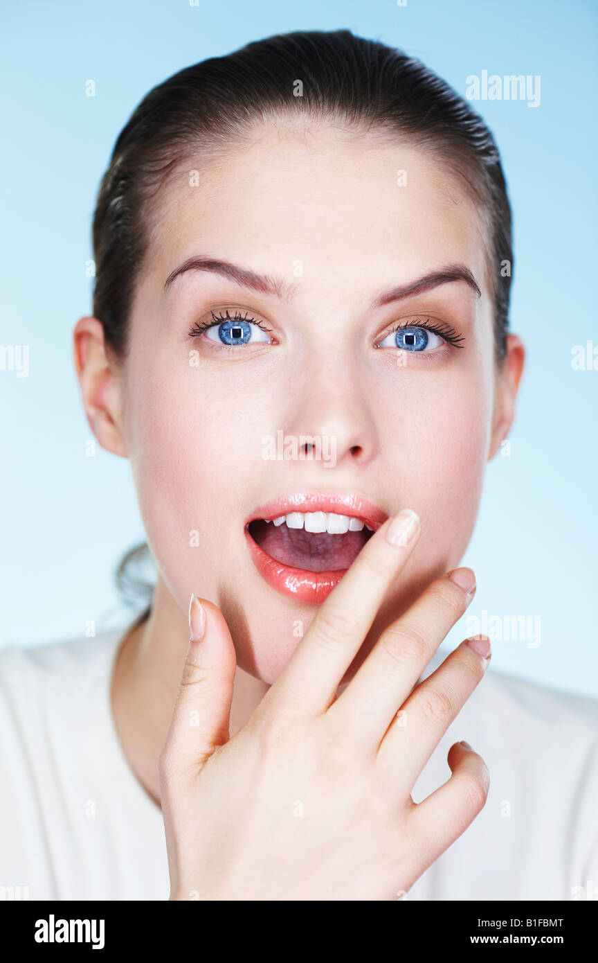 Portrait of young surprised woman Stock Photo - Alamy