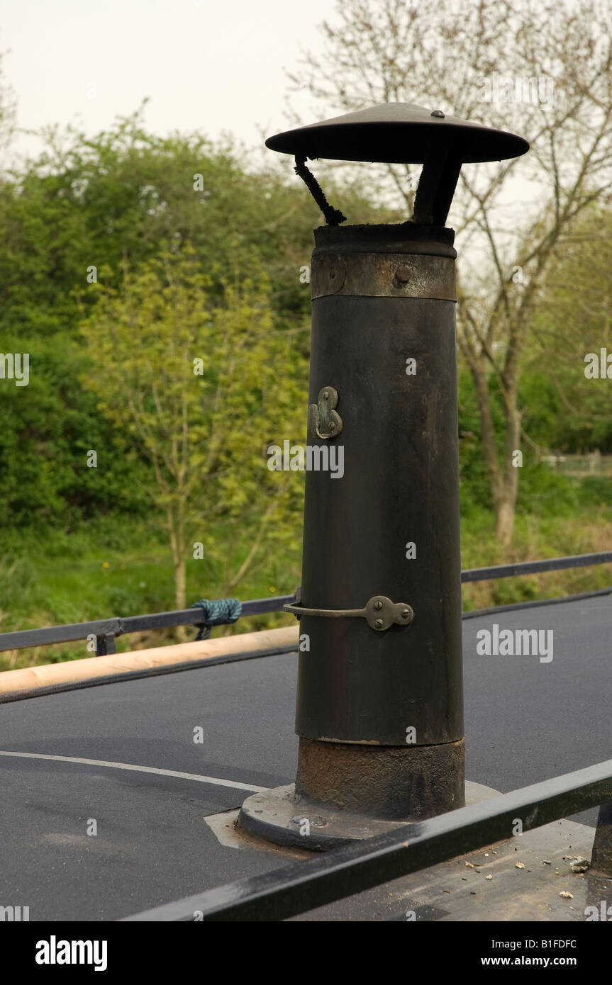 Close up of chimney on canal narrowboat narrow boat moored on Leeds Liverpool Canal Skipton Yorkshire Dales North Yorkshire England UK Stock Photo