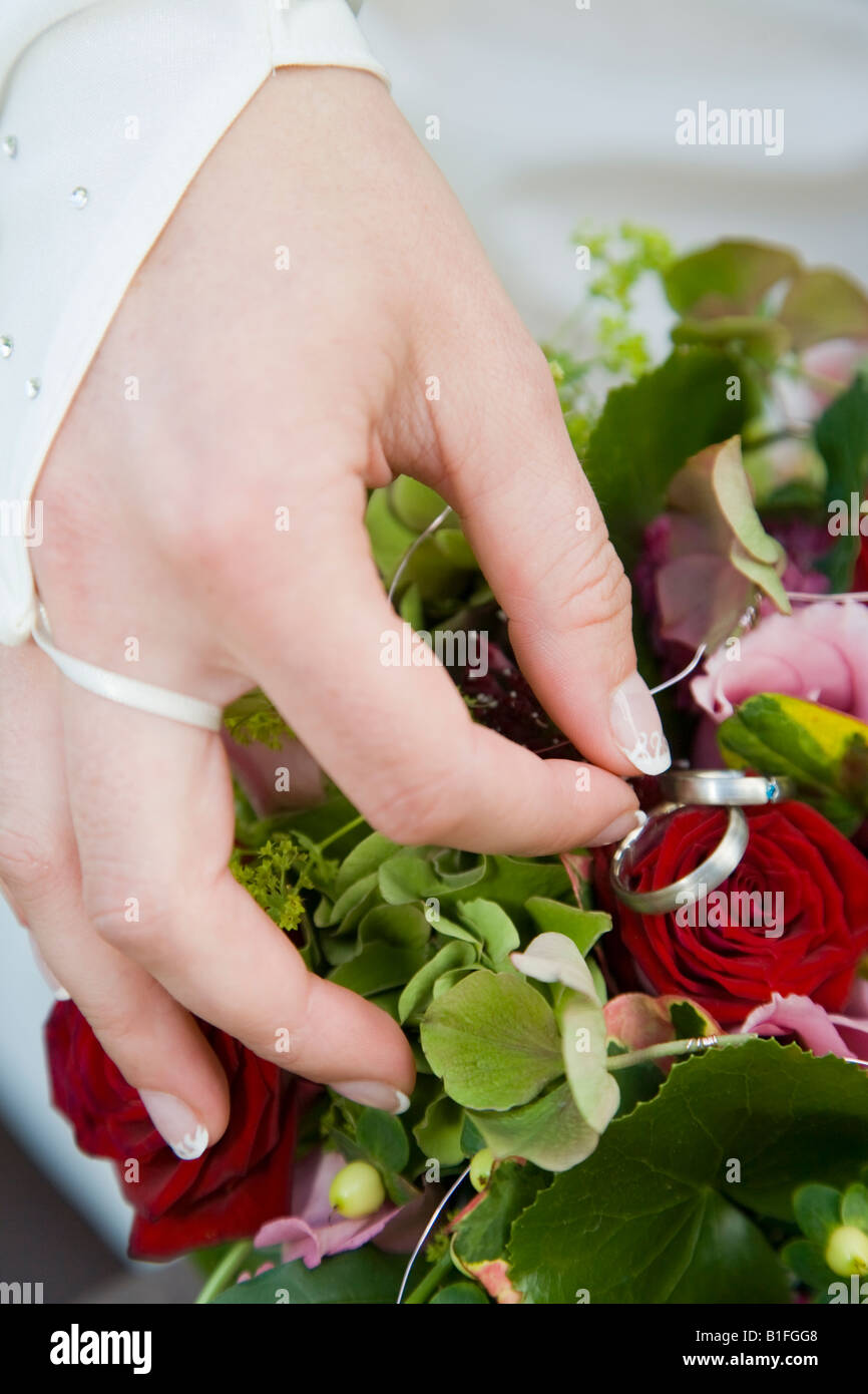 Wedding rings on flower bouquet Stock Photo Alamy