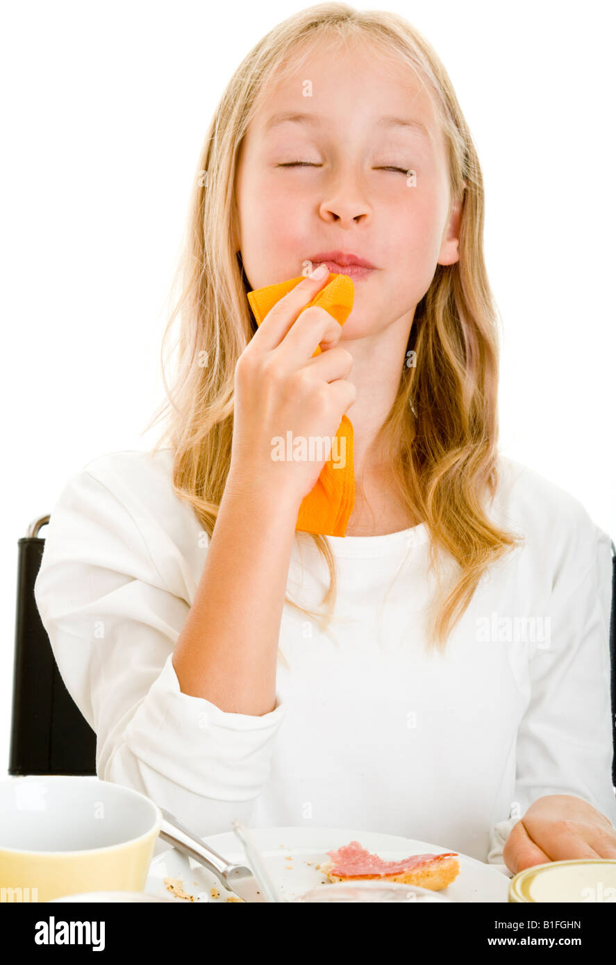 young blonde gril on a breakfast table Stock Photo