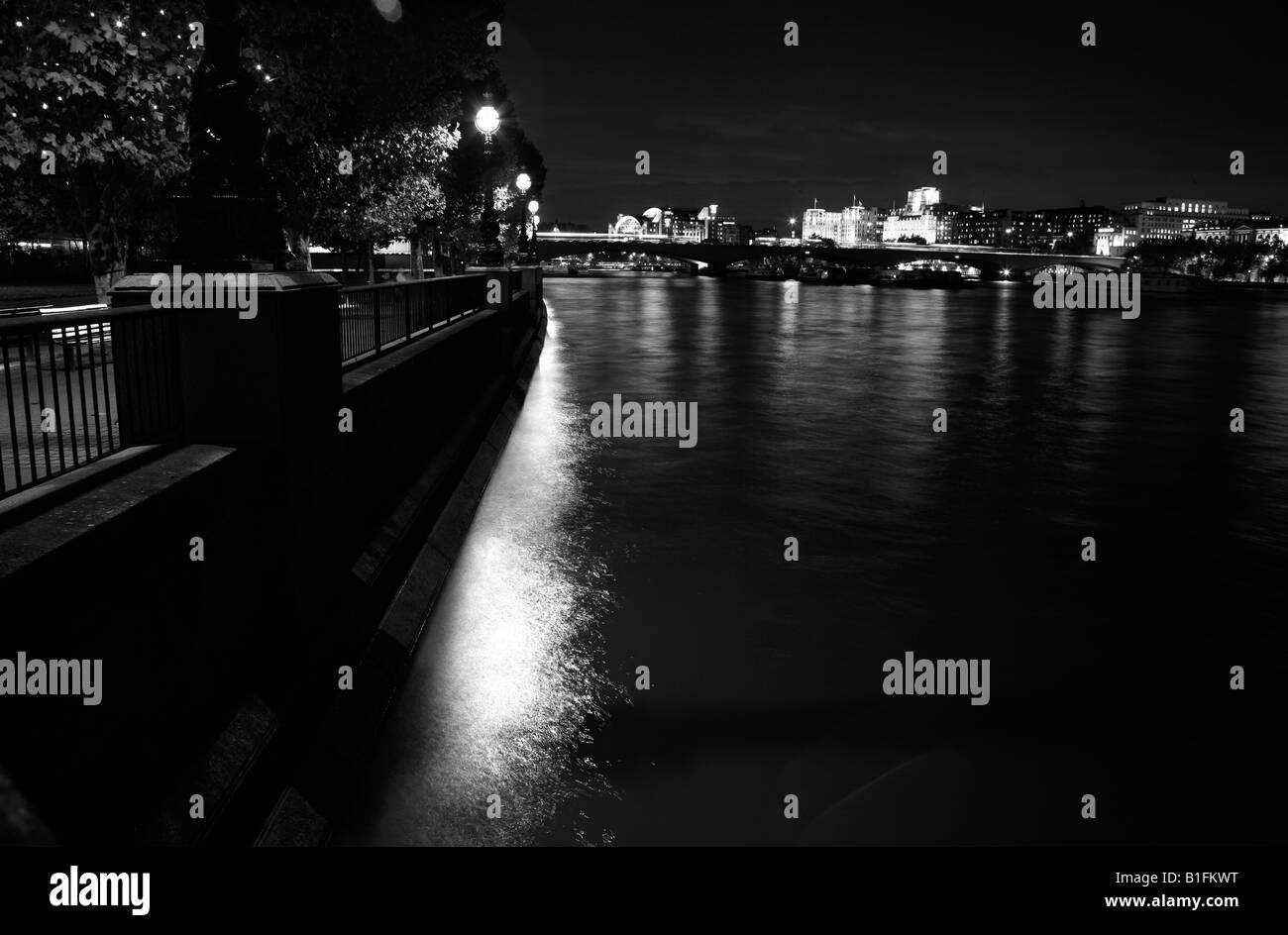 Nighttime view looking up the River Thames to Waterloo Bridge, South Bank, London Stock Photo