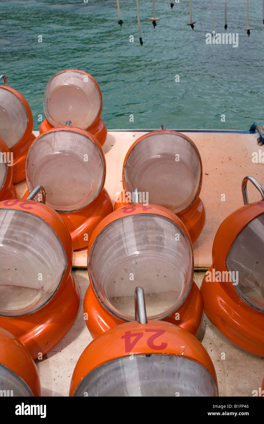 Red helmets used during underwater walks as breathing apparatus air is pumped into them via tube. Stock Photo