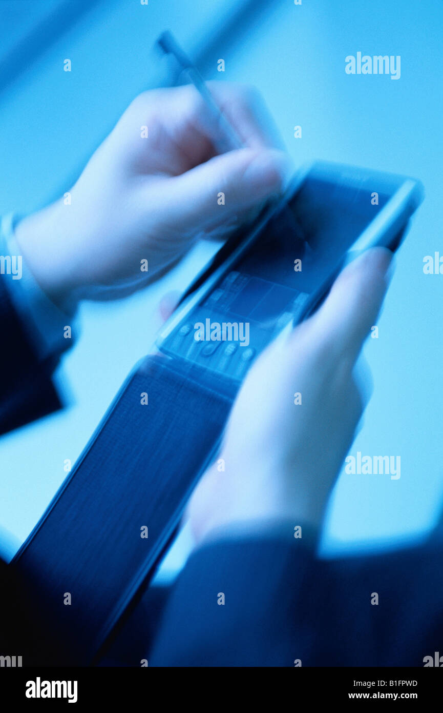 Man Using Handheld Computer Stock Photo - Alamy