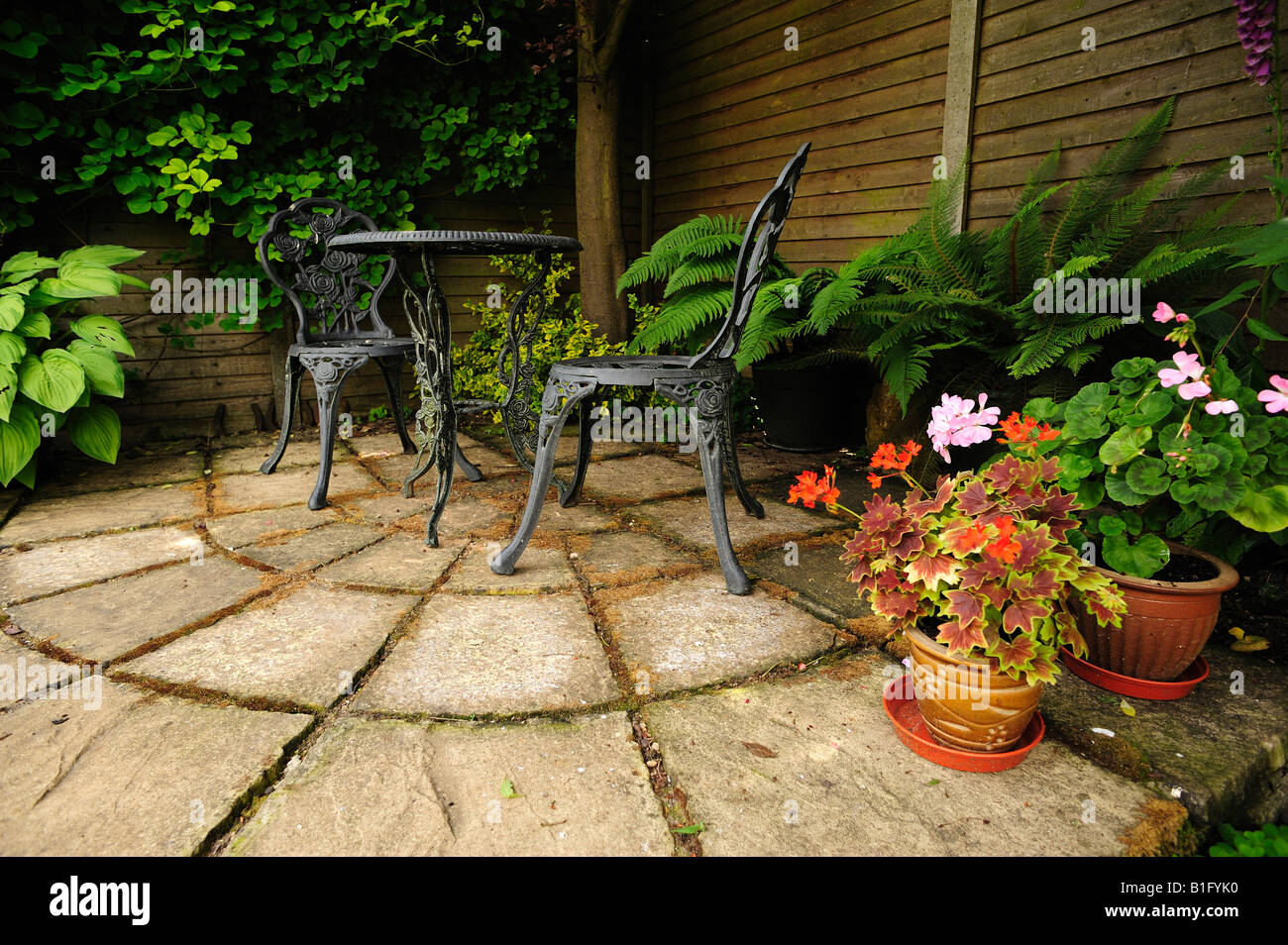 Quiet Corner with Table and Chairs in an English Summer Garden, with