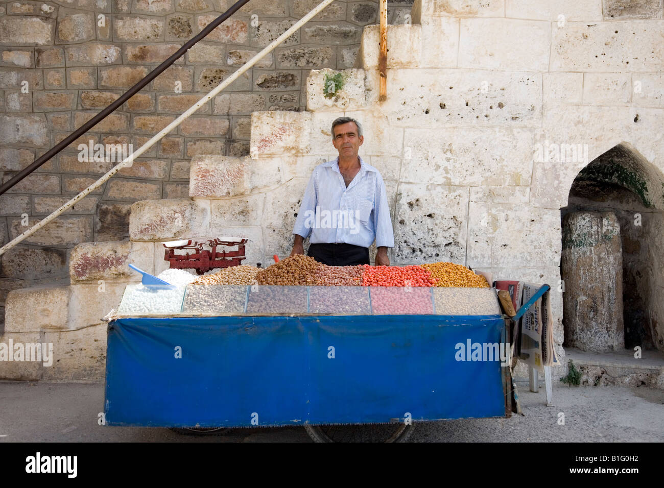 Street vendor selling roasted nuts hires stock photography and images