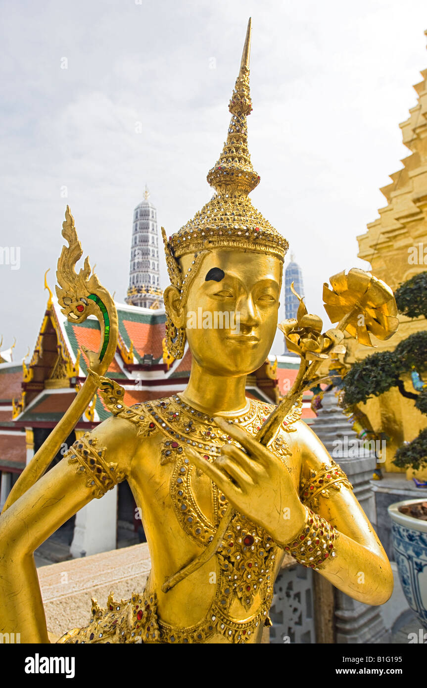 Beautiful gold leaf statue of Kinnara at Wat Phra Kaew, Bangkok