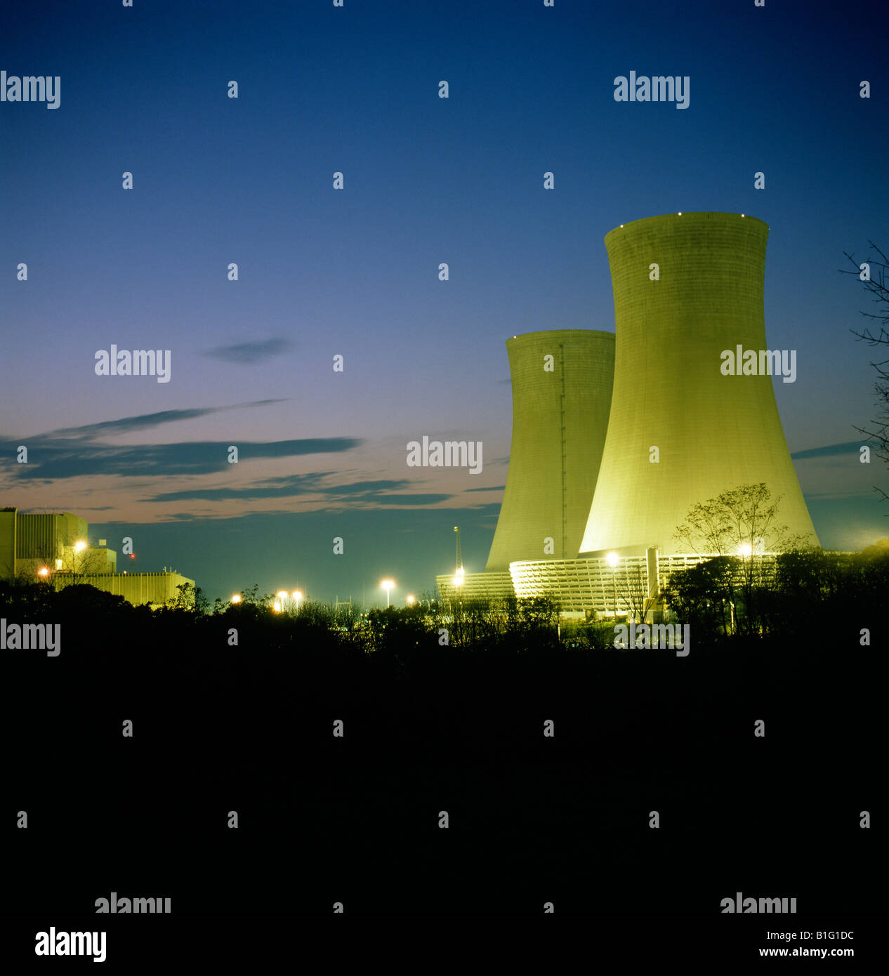 Cooling towers of a nuclear power plant at dusk Stock Photo - Alamy
