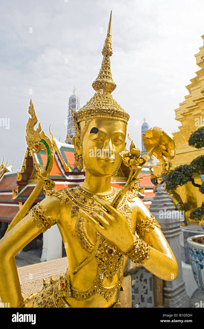 Beautiful gold leaf statue of Kinnara at Wat Phra Kaew, Bangkok
