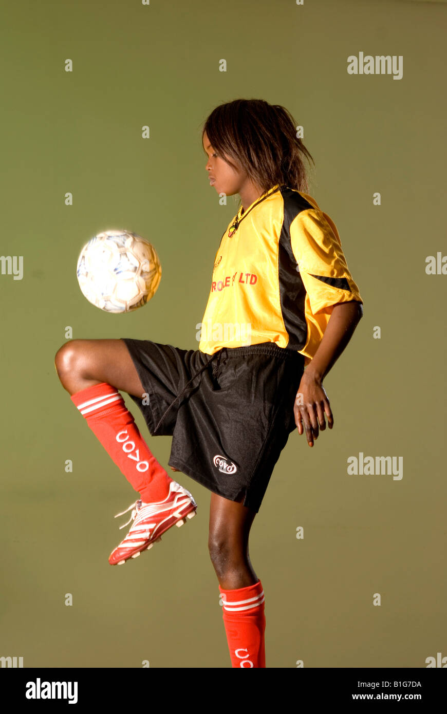 black african female soccer player with ball Stock Photo - Alamy