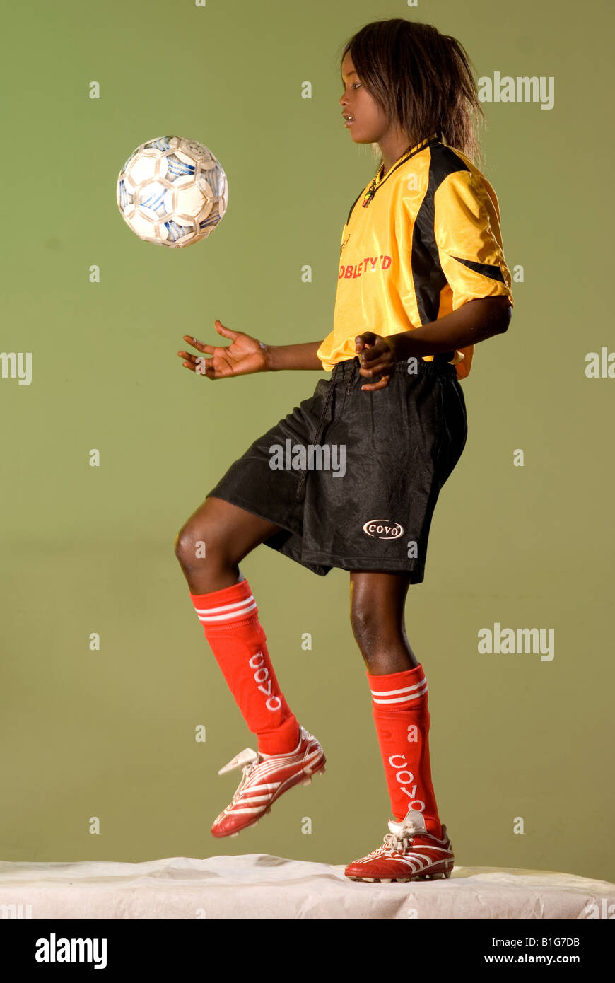 black african female soccer player with ball Stock Photo - Alamy
