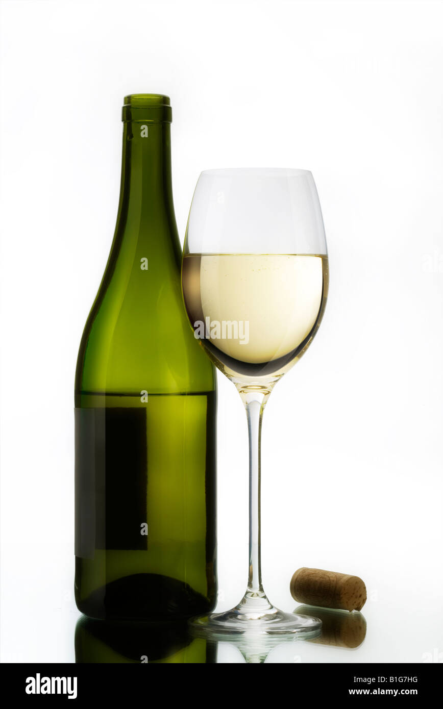 A glass of white wine with cork and bottle on a mirrored surface Stock Photo