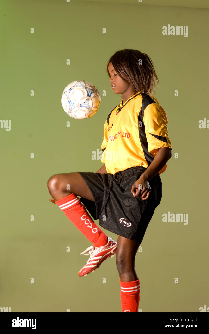 black african female soccer player with ball Stock Photo - Alamy