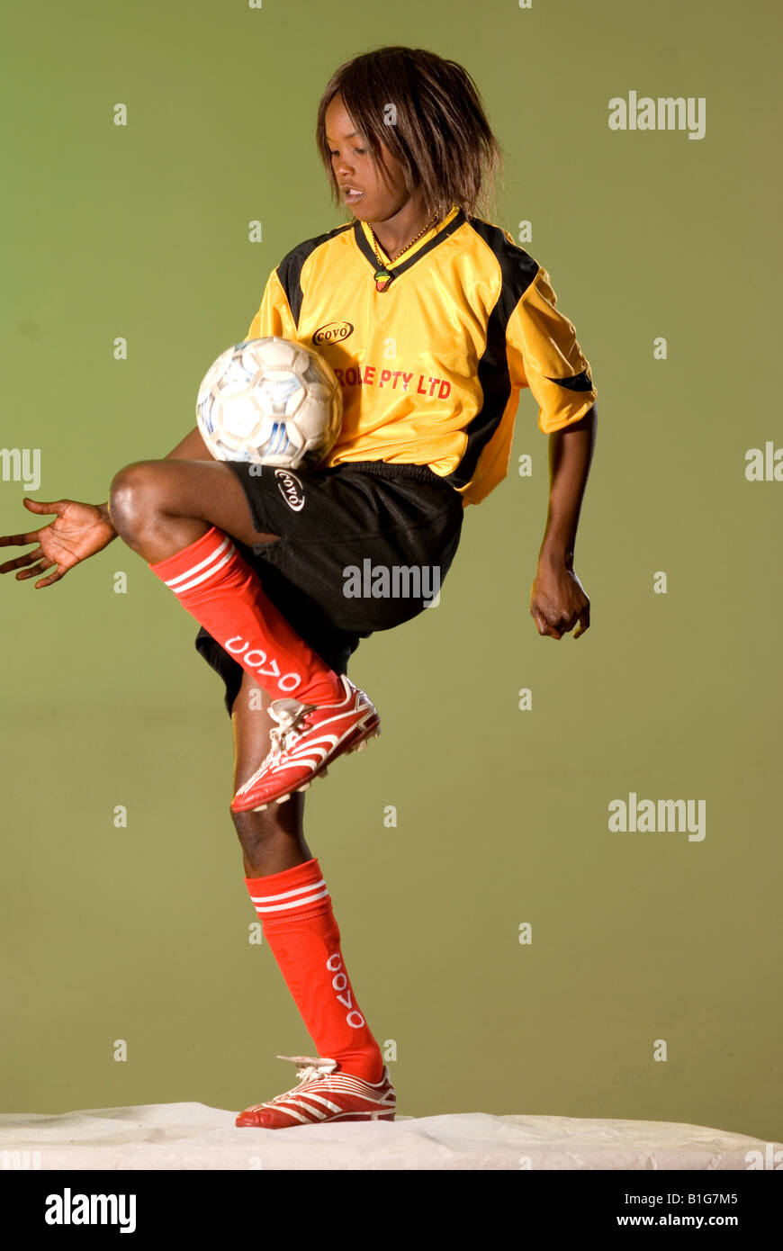 black african female soccer player with ball Stock Photo - Alamy