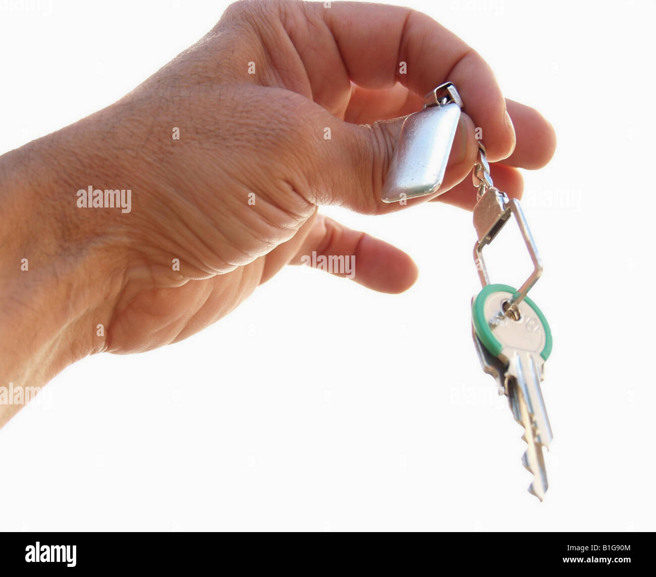 Close-up of a hand holding keys with key chain Stock Photo - Alamy