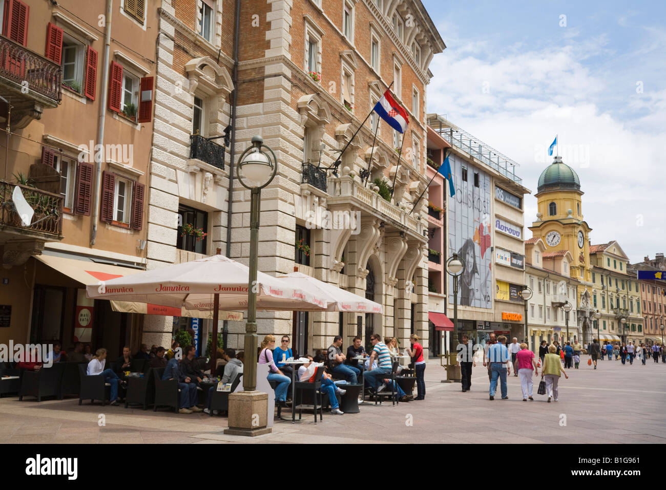 People dining and drinking in outdoor cafe in pedestrianised Korzo Street in city centre. Rijeka Croatia Europe Stock Photo