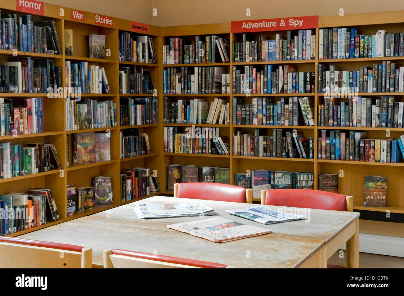 Branch library interior, community resource & facility (chairs, newspapers on tables, bookcases