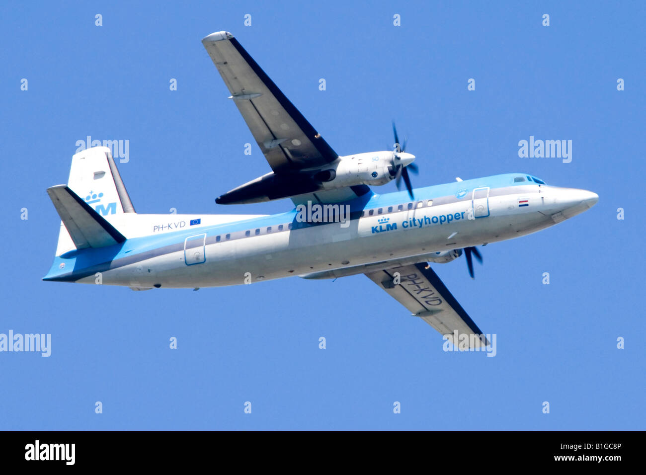 Fokker 50 operated by KlM climbing out from London Heathrow Airport. Stock Photo