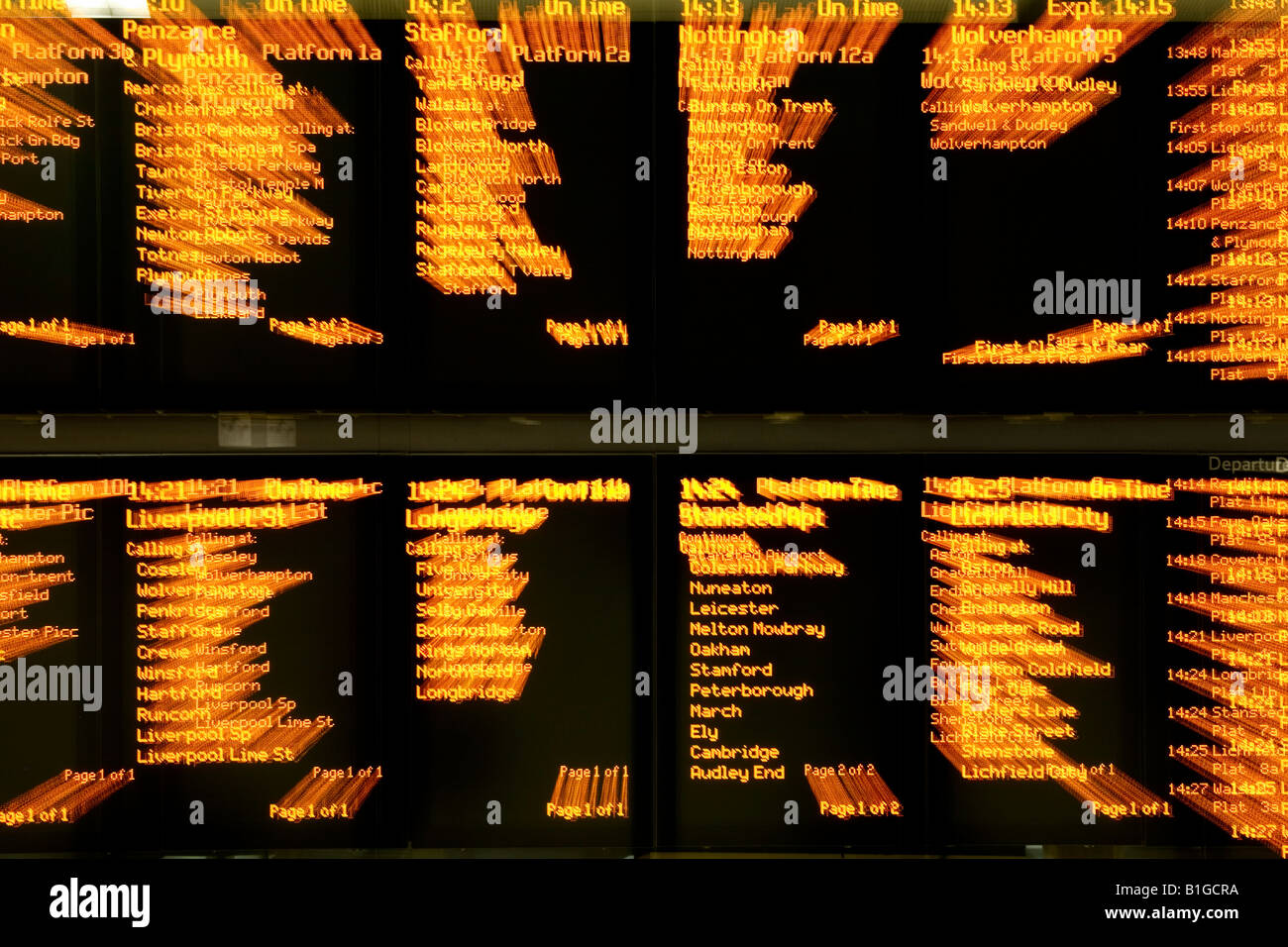 A train timetable in a railway station zoomed in on Stock Photo