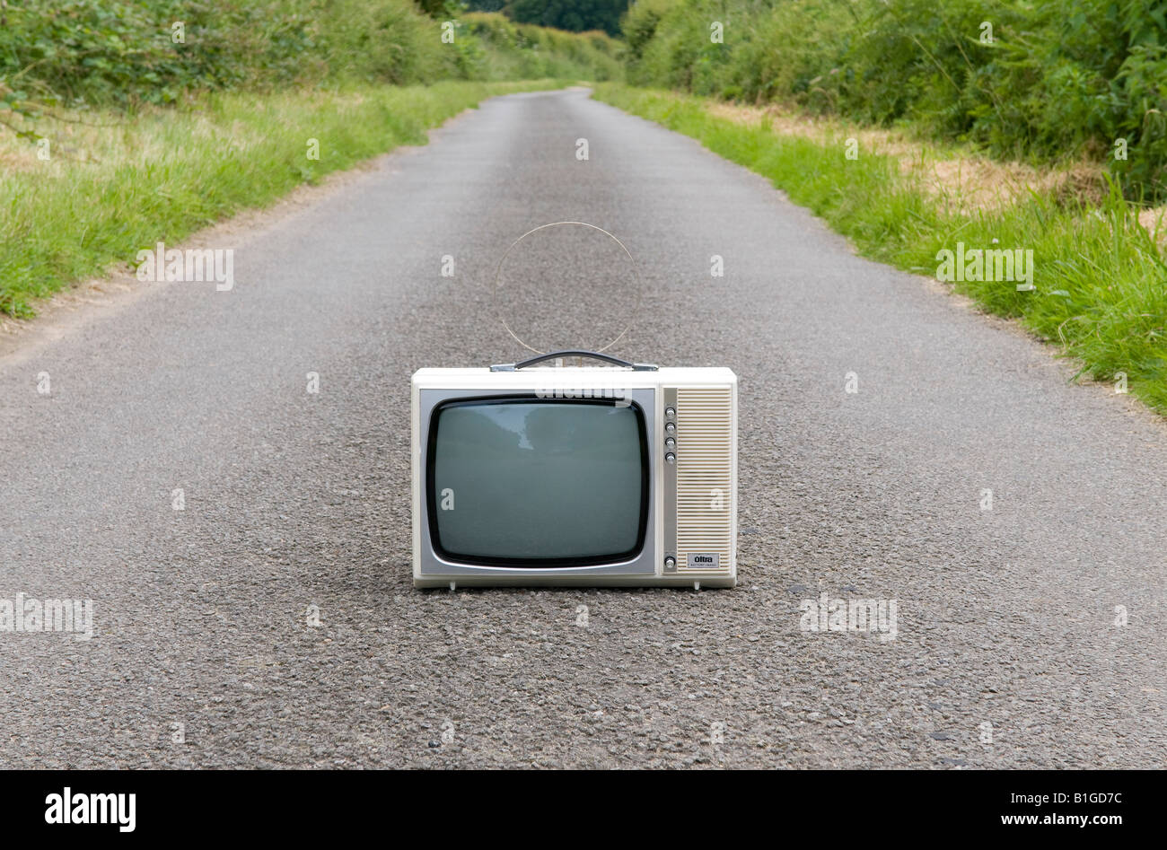 retro style portable television on country road Stock Photo