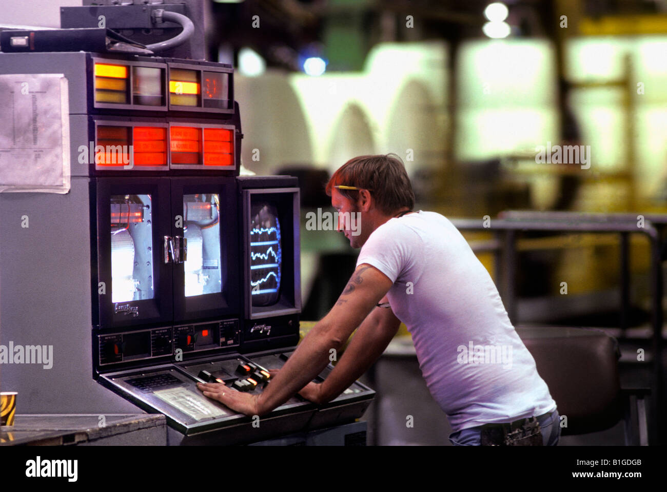 Factory worker monitoring plant controls in paper mill Stock Photo - Alamy
