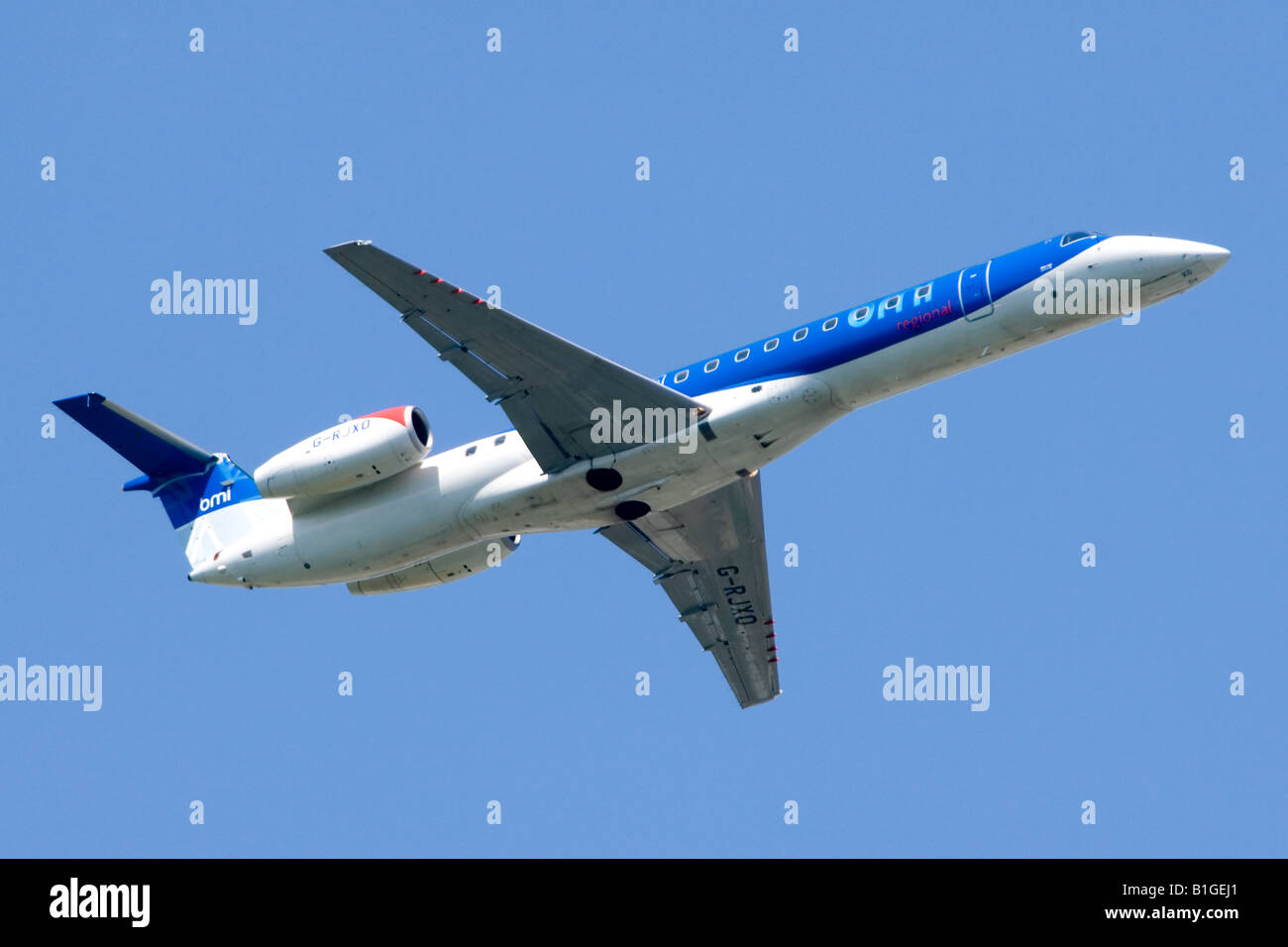Embraer ERJ-145 operated by BMI climbing out from London Heathrow Airport. Stock Photo