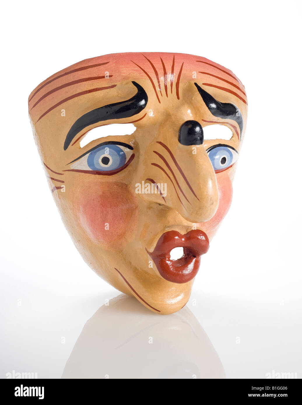Peruvian paper mache mask of human face with nose wart and pucker lips for  kiss and blue eyes Stock Photo - Alamy