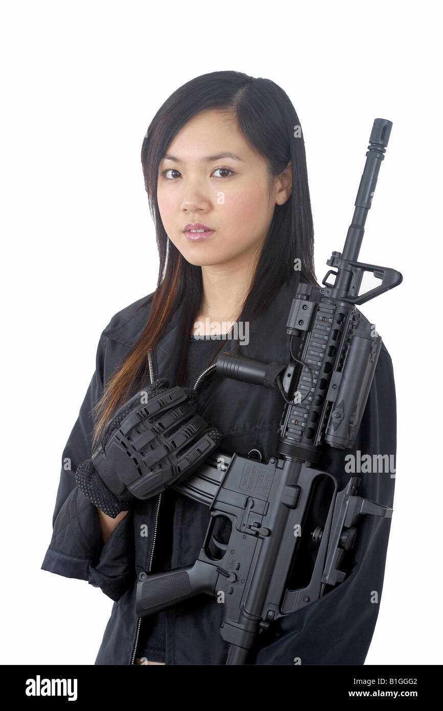 Girl woman gun killer kill assassin full auto assassin sas swat navy seal  special force protect ghost in the shell comic manga a Stock Photo - Alamy