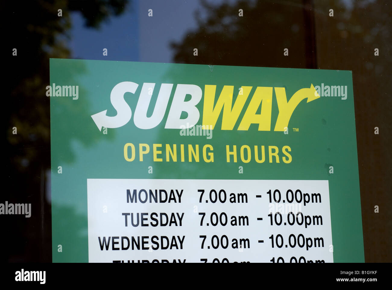 Subway food outlet opening hours sign, UK Stock Photo