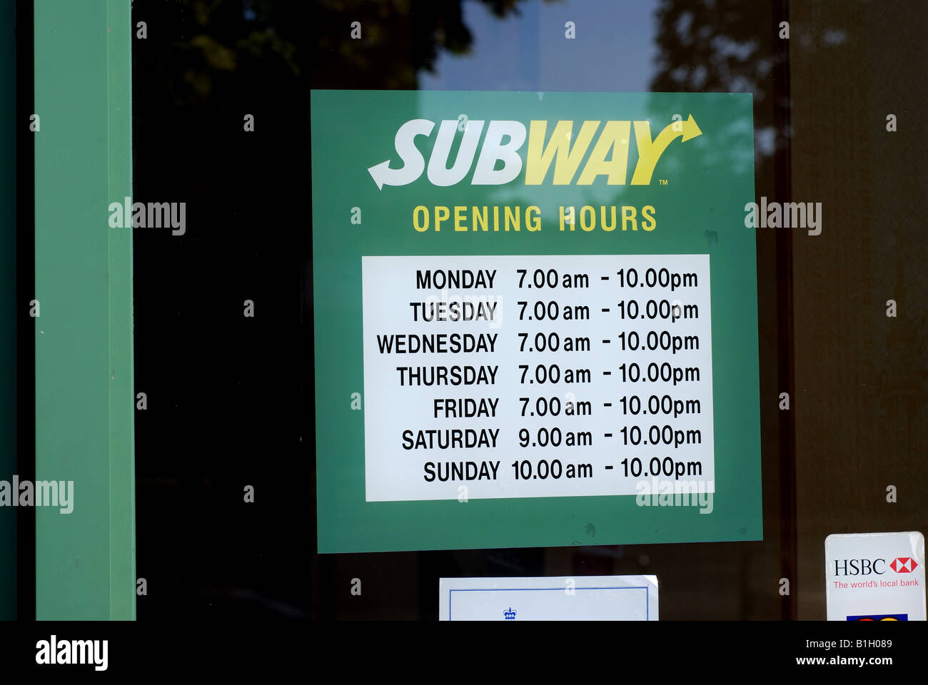 Subway food outlet opening hours sign, UK Stock Photo