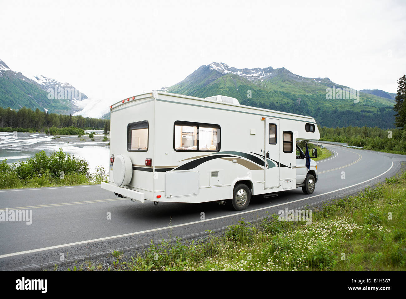 USA, Alaska, recreational vehicle driving on road, side view Stock