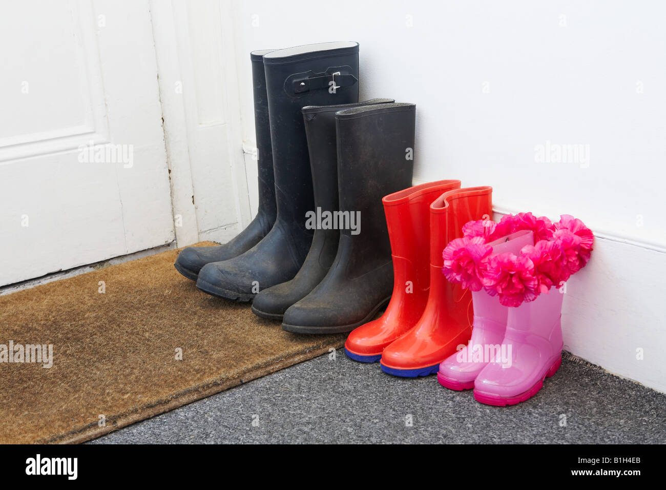 Rubber boots in hallway Stock Photo