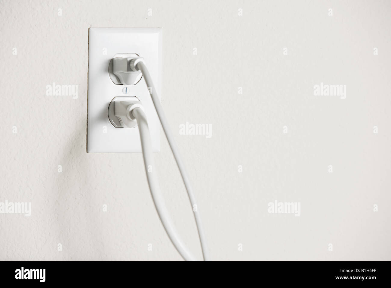 Electrical plug in a socket Stock Photo Alamy
