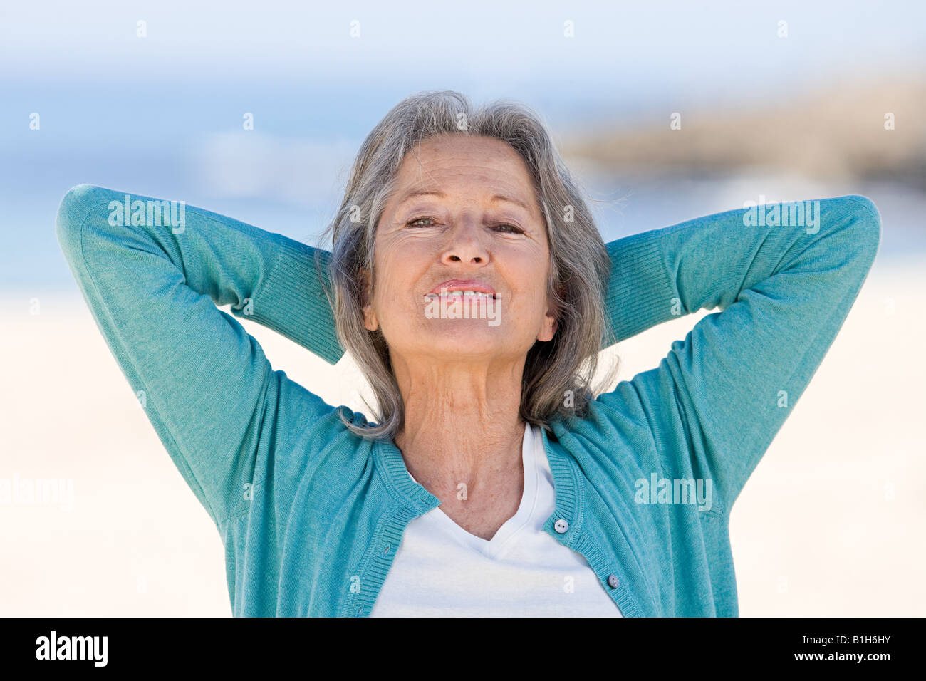 Woman hands behind head hi-res stock photography and images - Alamy