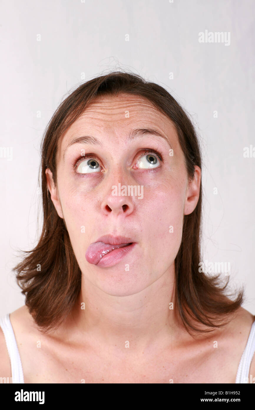 Concentration woman tongue hires stock photography and images Alamy