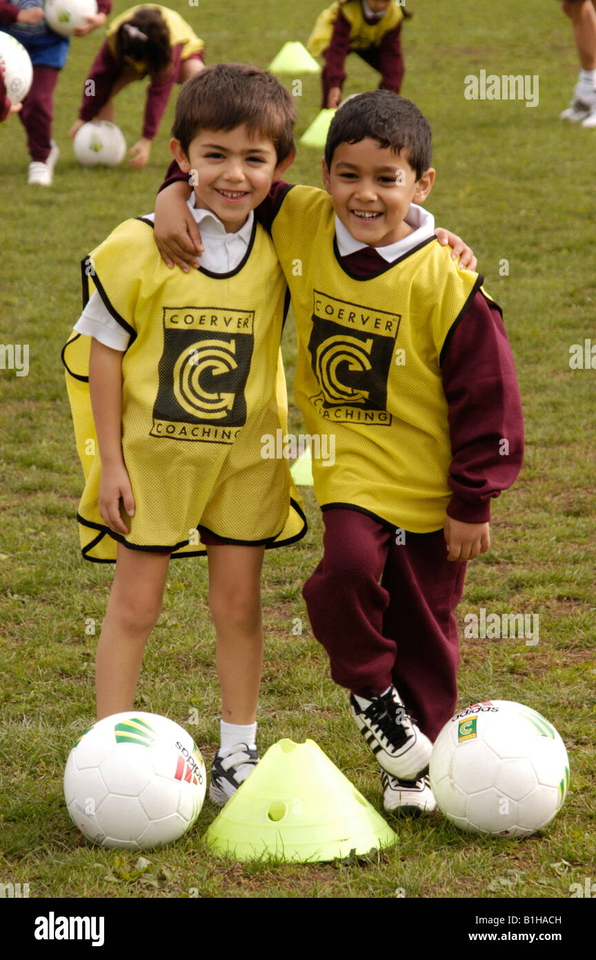 two boys hugging in football Stock Photo