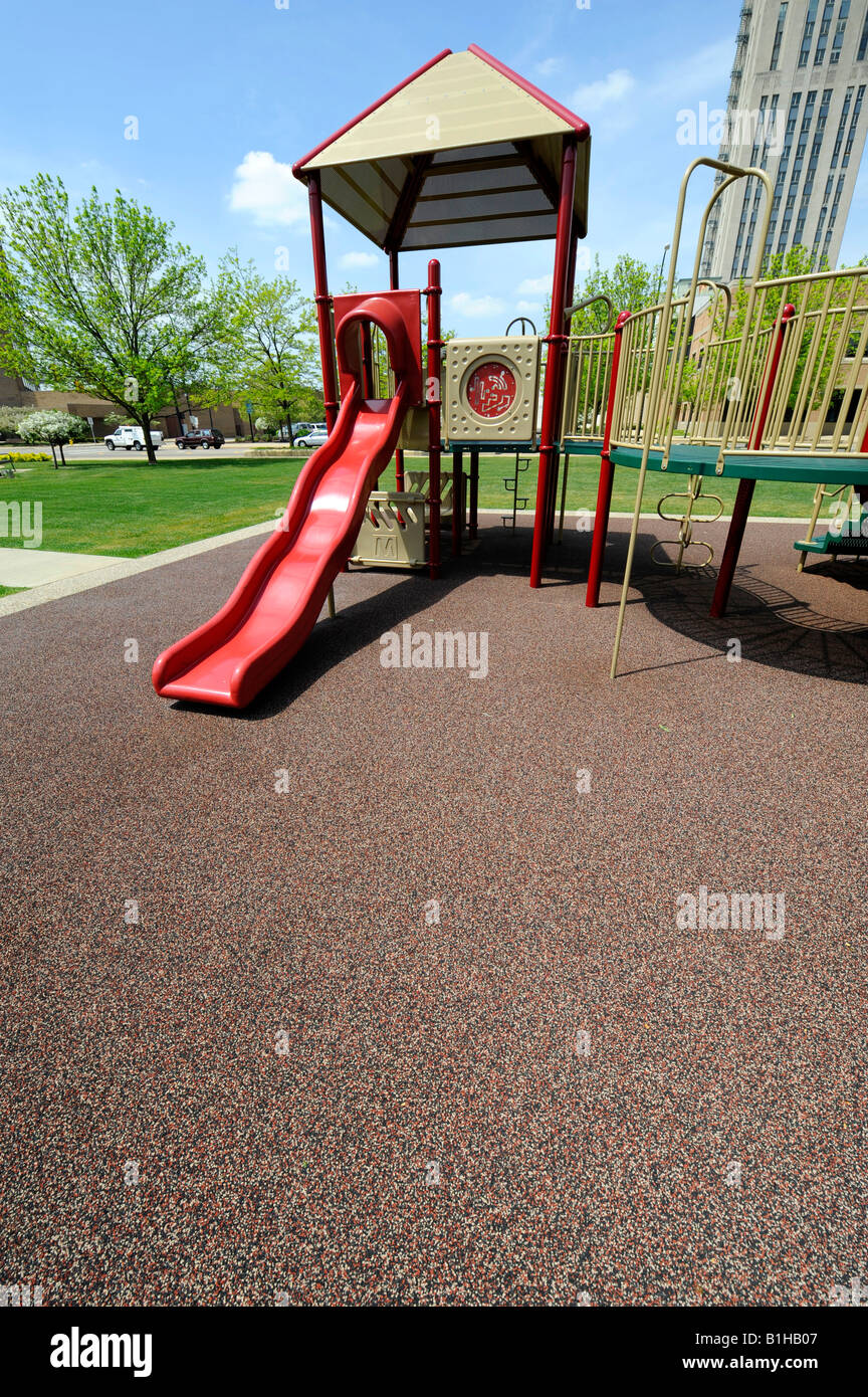 Childrens play park with surface made from recycled automobile tires in Battle Creek Michigan Stock Photo
