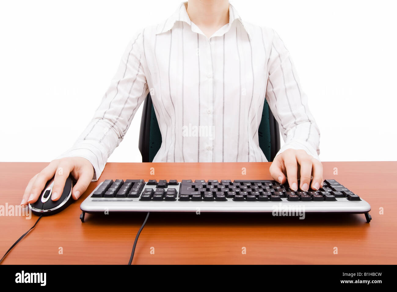 Woman typing desktop computer Cut Out Stock Images & Pictures - Alamy