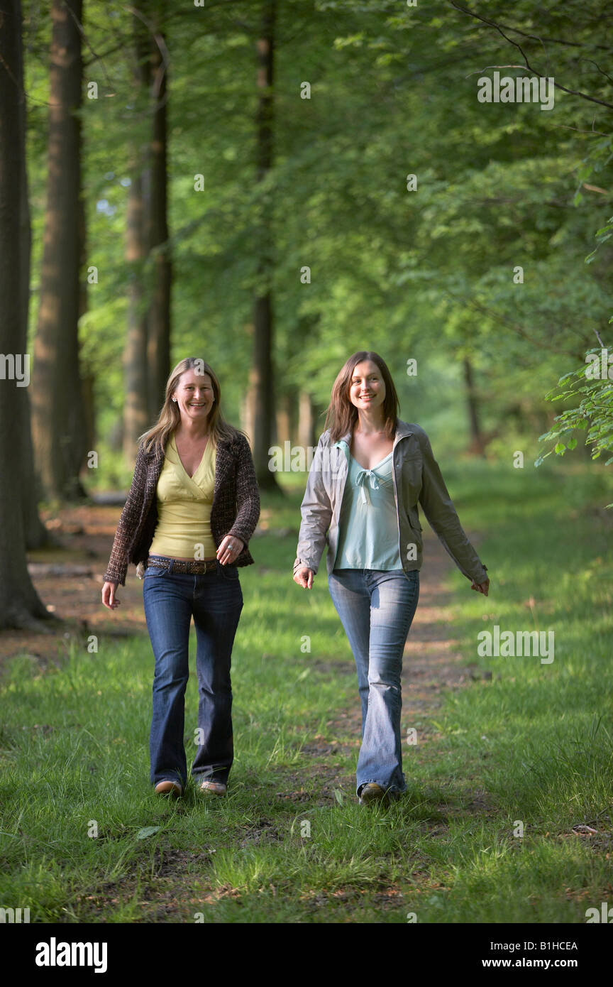 Two women walking on park hi-res stock photography and images - Alamy