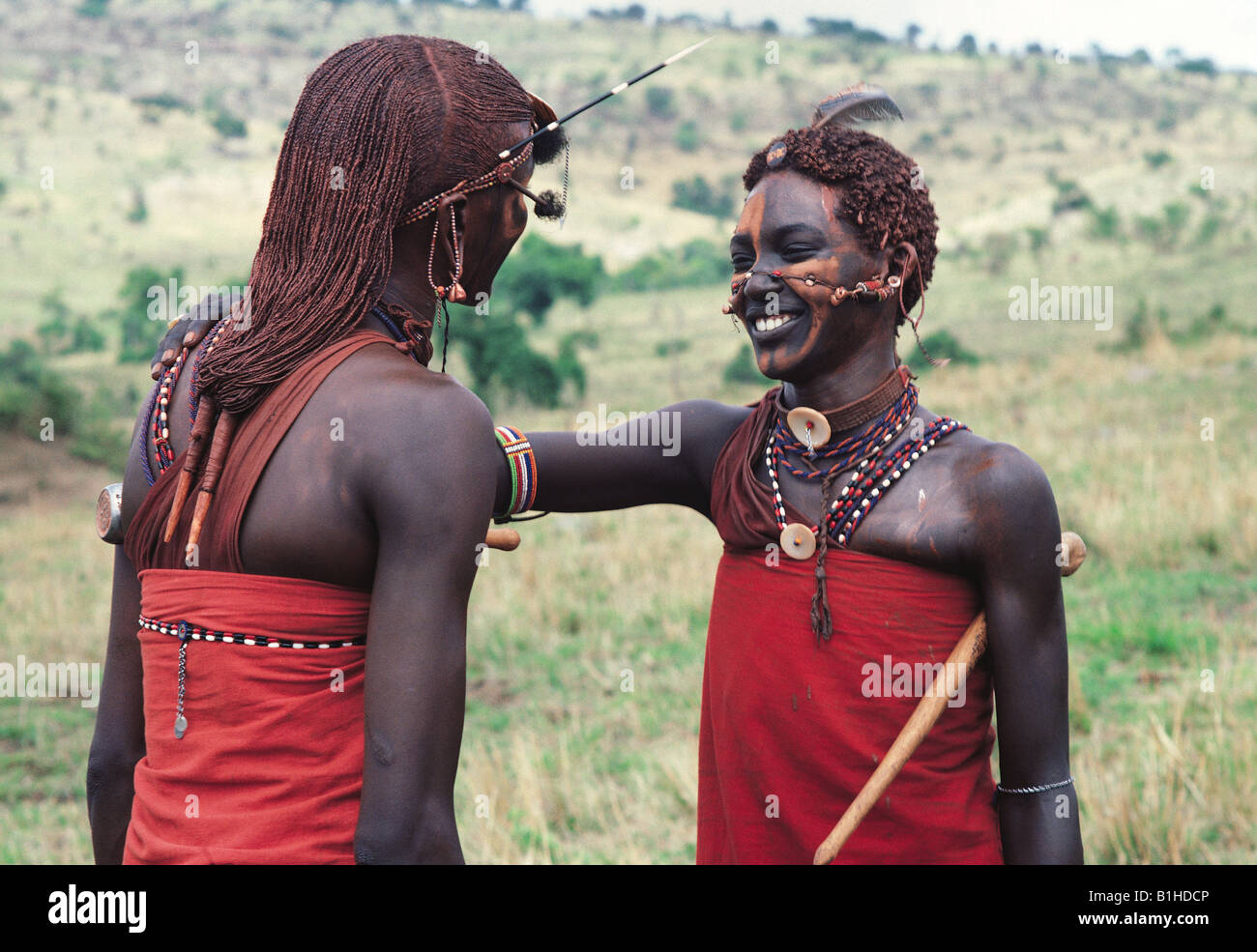Two Maasai moran warriors greeting each other Masai Mara National