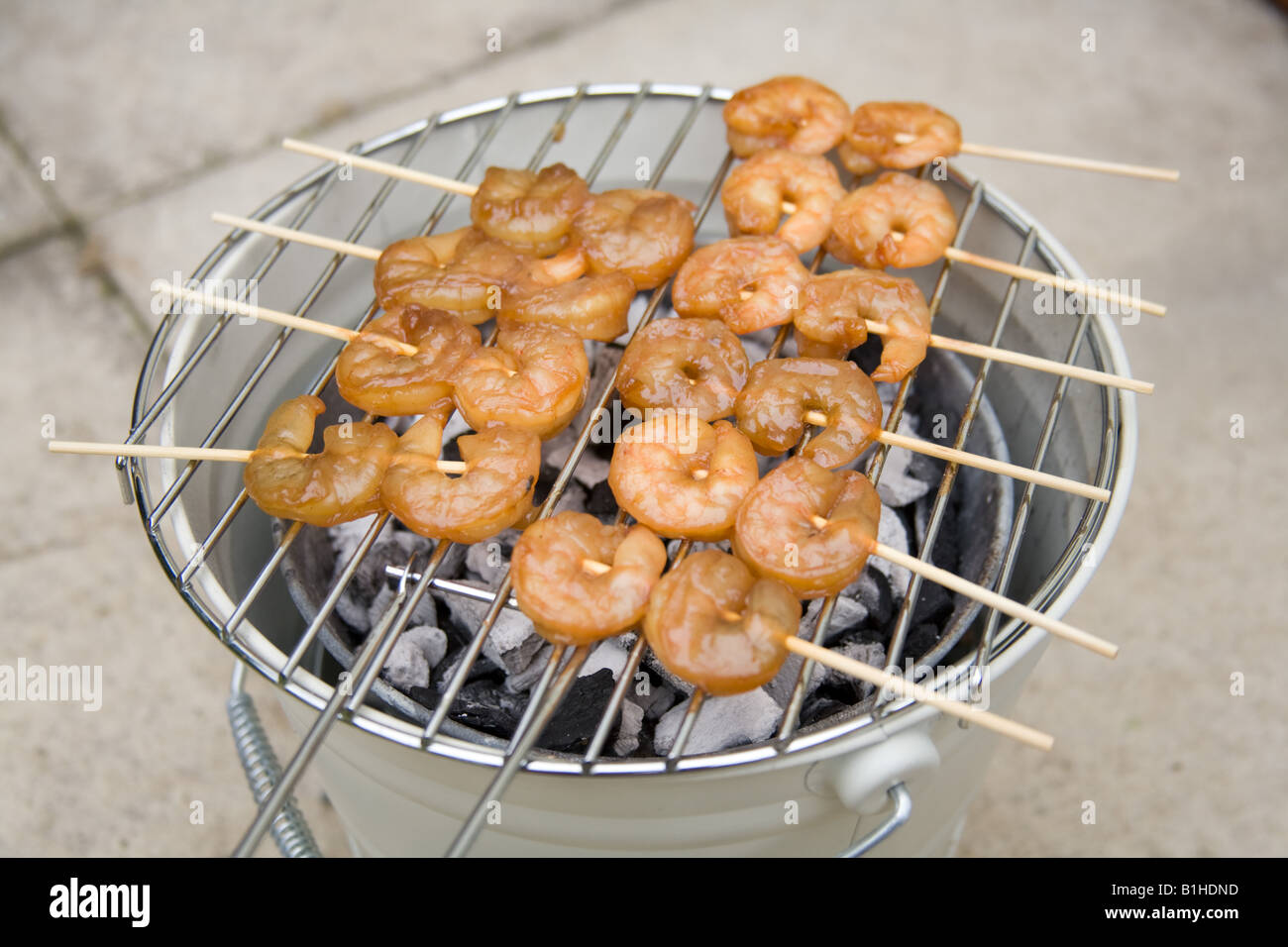 Barbecued king prawn kebabs, London, England. Stock Photo