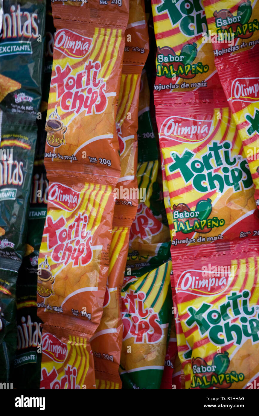 Packets of crisps and snacks are hung up for display in the market at