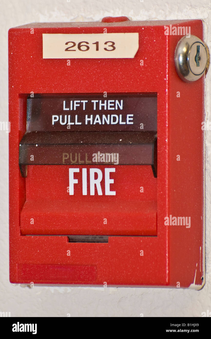 fire alarm call box pull handle manually Stock Photo - Alamy