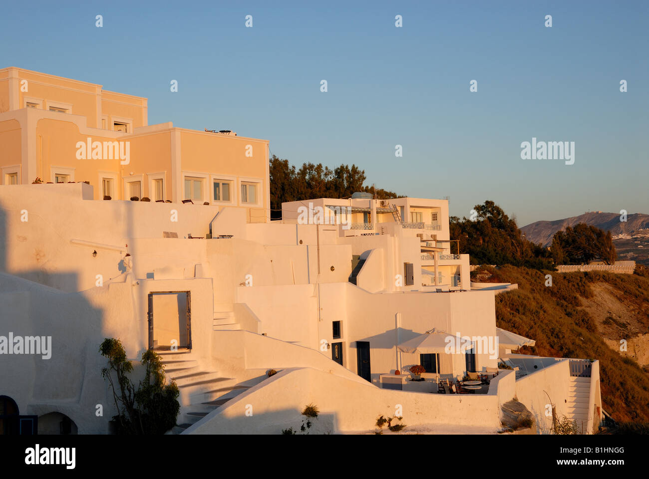 Houses in Santorini at sunset, Greece Stock Photo