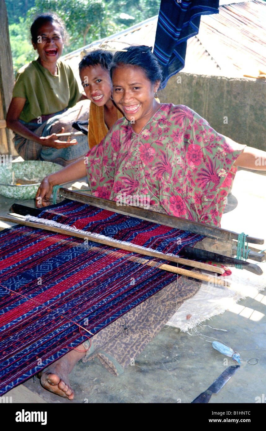 Woman weaving Ikat tapestry near Kelimutu, Flores island, Indonesia, Stock Photo