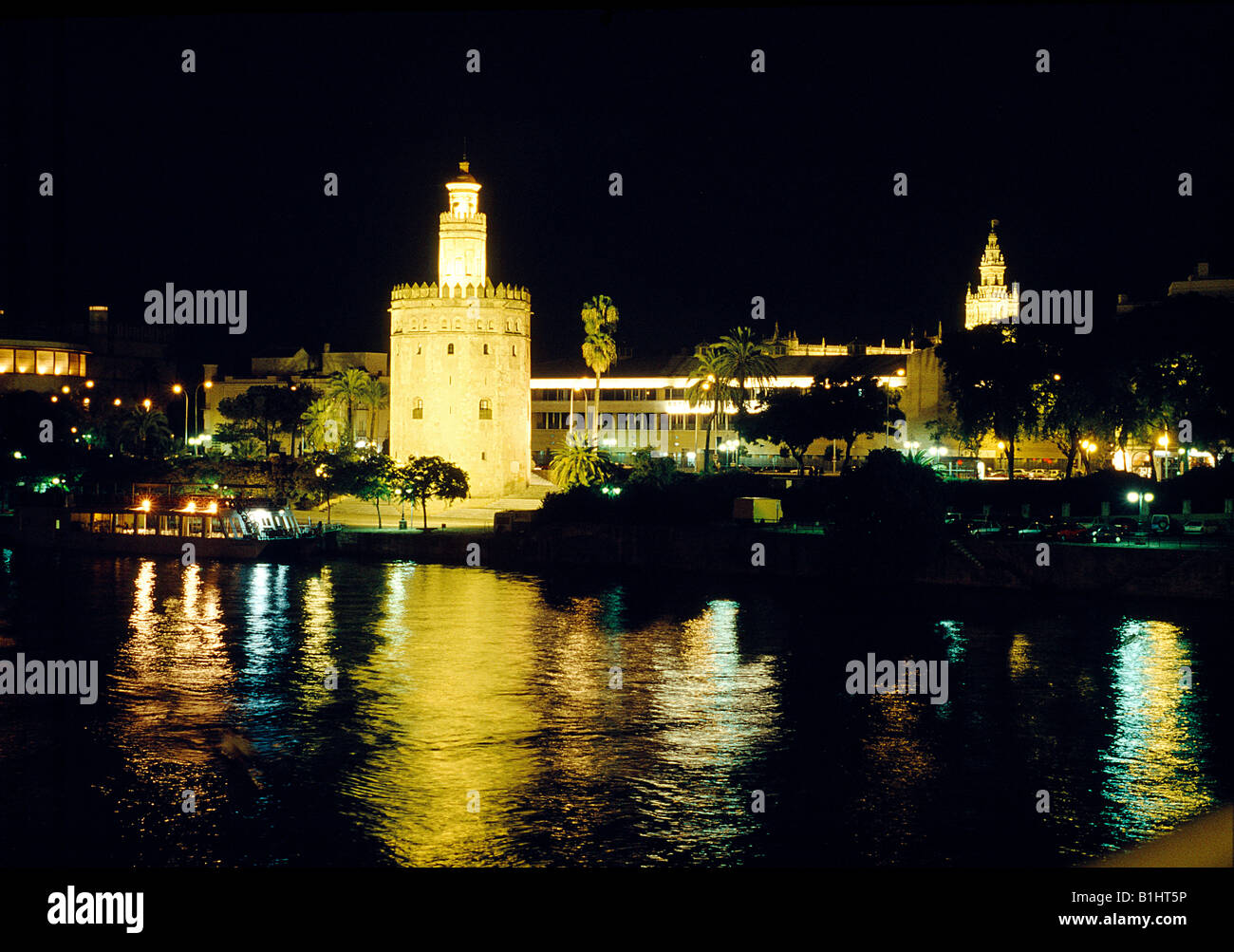 Torre del Oro, the Giralda and river Guadalquivir. Night view. Sevilla. Andalusia. Spain. Stock Photo