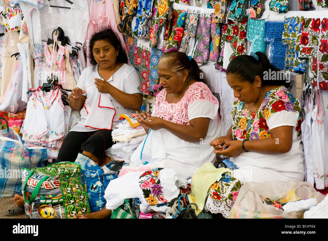 Mayan women selling embroidery goods in Valladolid Mexico Stock Photo