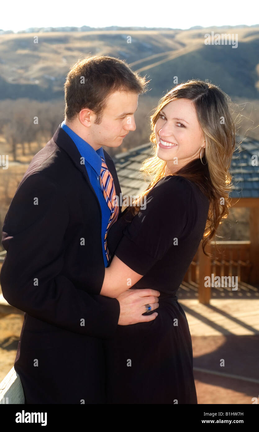 Happy couple embracing, overlooking coulees. Stock Photo