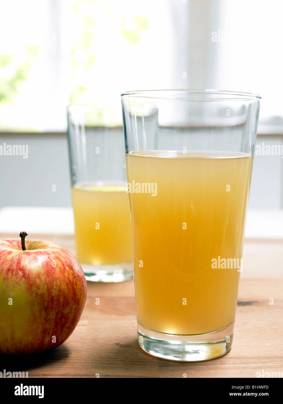 Glass of unfiltered apple juice Stock Photo Alamy