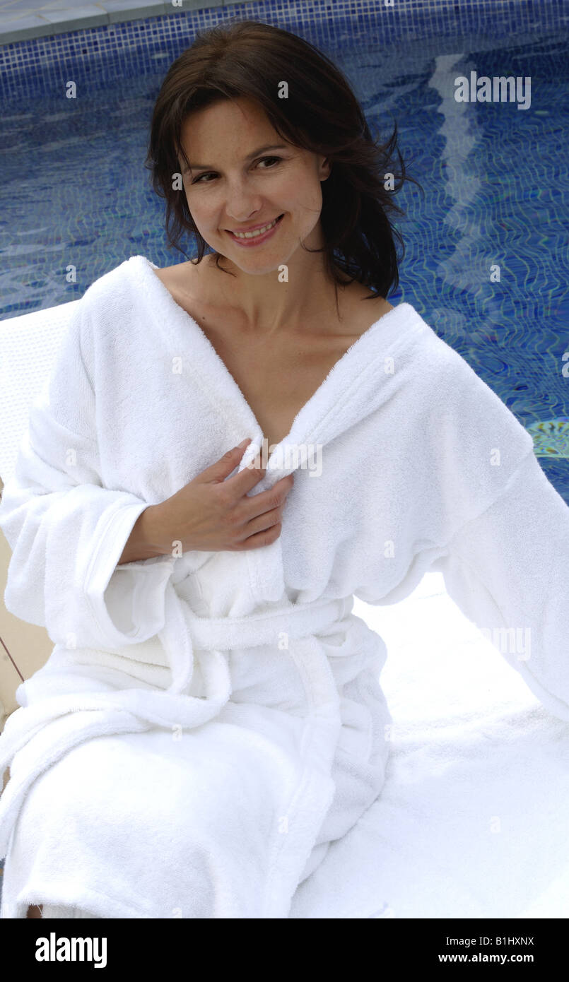 Woman at the swimming pool in a bathrobe Stock Photo Alamy