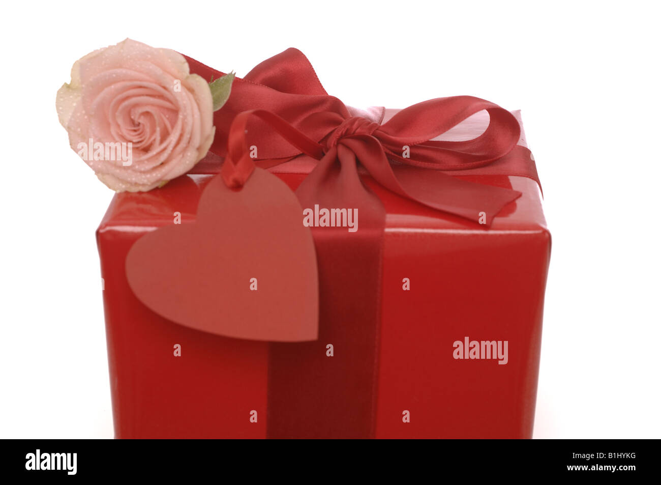 Red gift with a pink rose Stock Photo